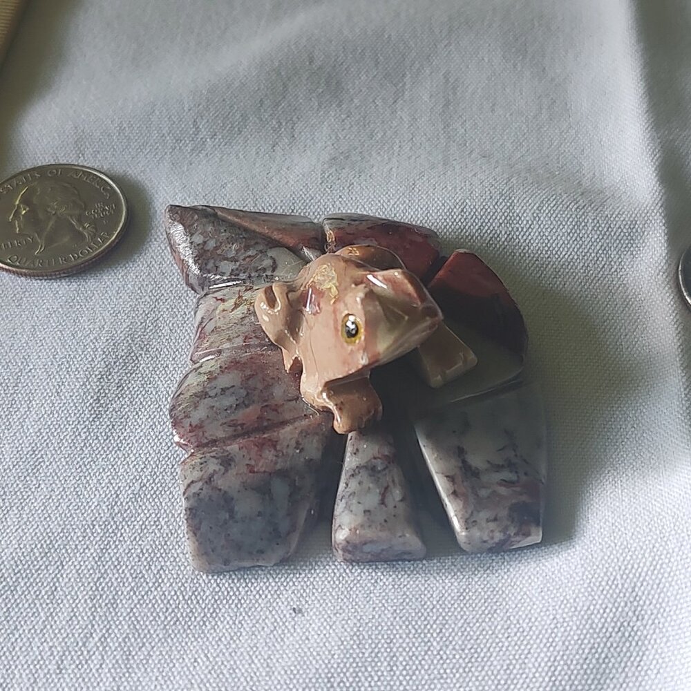 carved figurine of a frog or toad, likely a "money toad" or "three-legged toad"